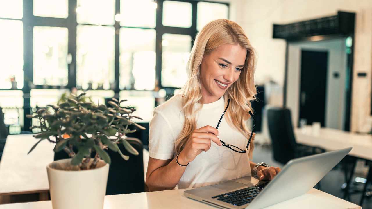 Women looking into laptop happy