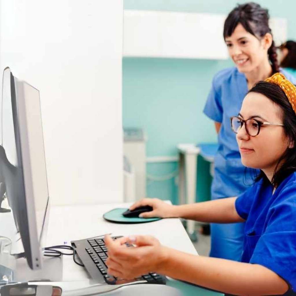 picture of two healthcare employee with computer
