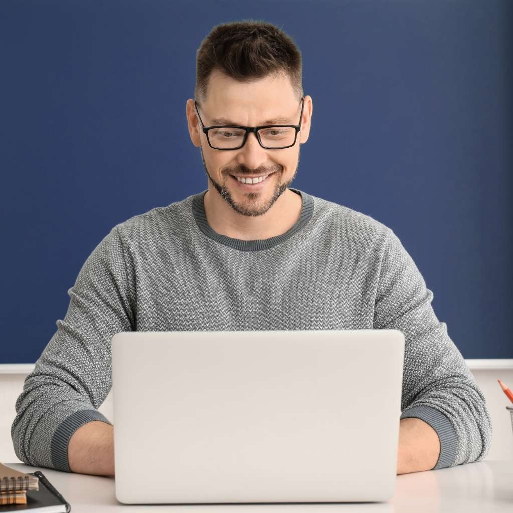image of a teacher with a laptop
